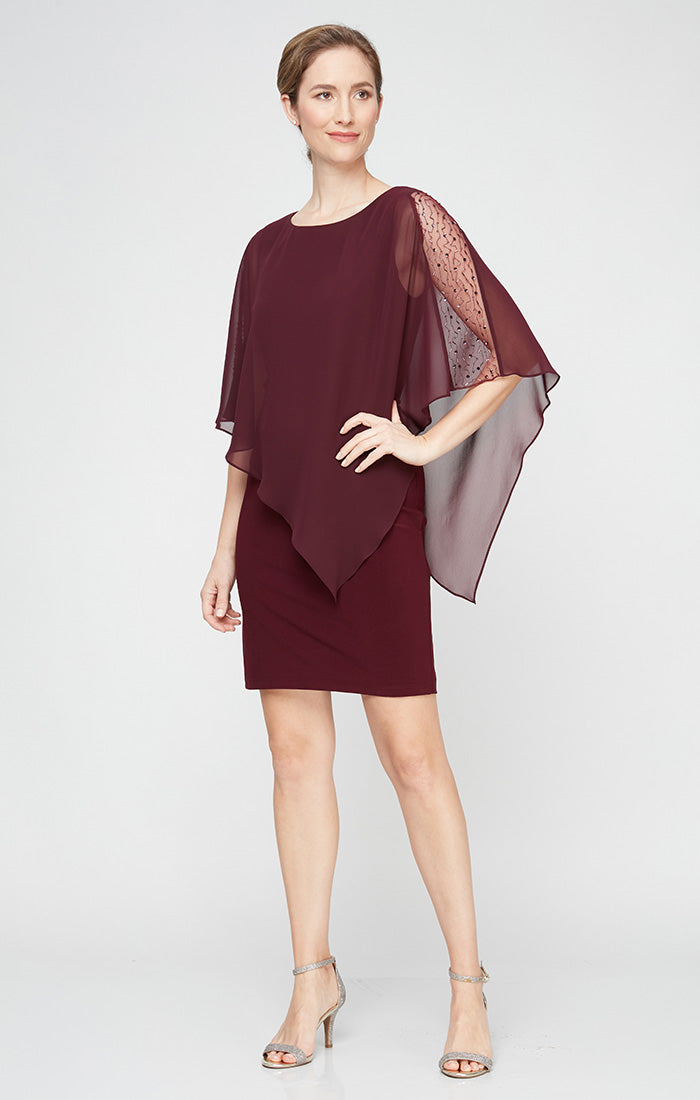 Jersey Sheath Dress with Asymmetric Chiffon Capelet with Embellished Illusion Panel Jersey Sheath Dress with Asymmetric Chiffon Capelet with Embellished Illusion Panel