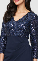 Long Stretch Sequin Empire Waist Dress with V-Neckline and Scuba Crepe Cascade Detail Skirt